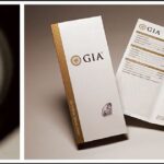 En slipad diamant sedd genom en lupp bredvid ett GIA-certifikat.