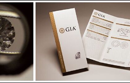 En slipad diamant sedd genom en lupp bredvid ett GIA-certifikat.